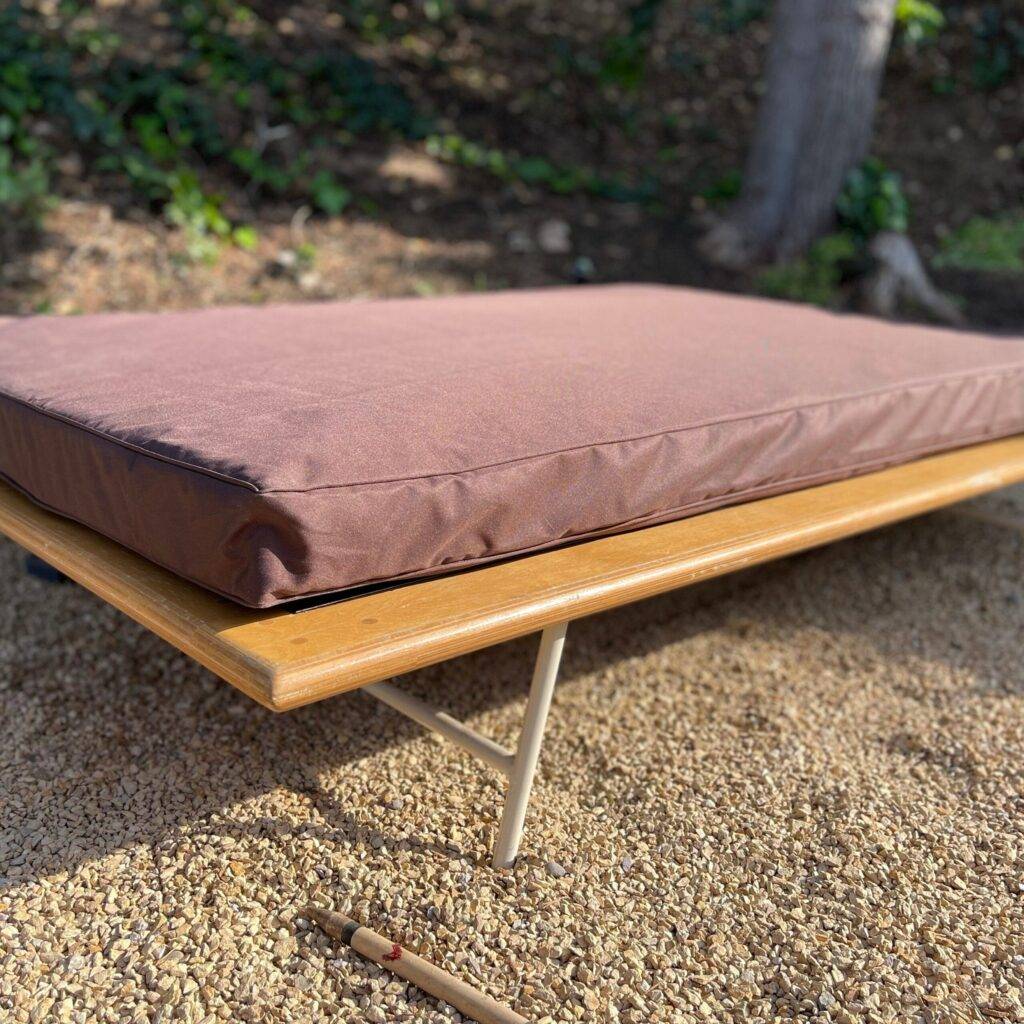 rey herrera an outdoor bed styled with waterproof mattress in chocolate color