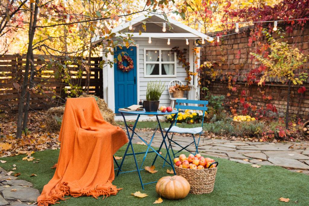 Autumn country yard or garden with cozy table ideas for porch decor for fall autumn