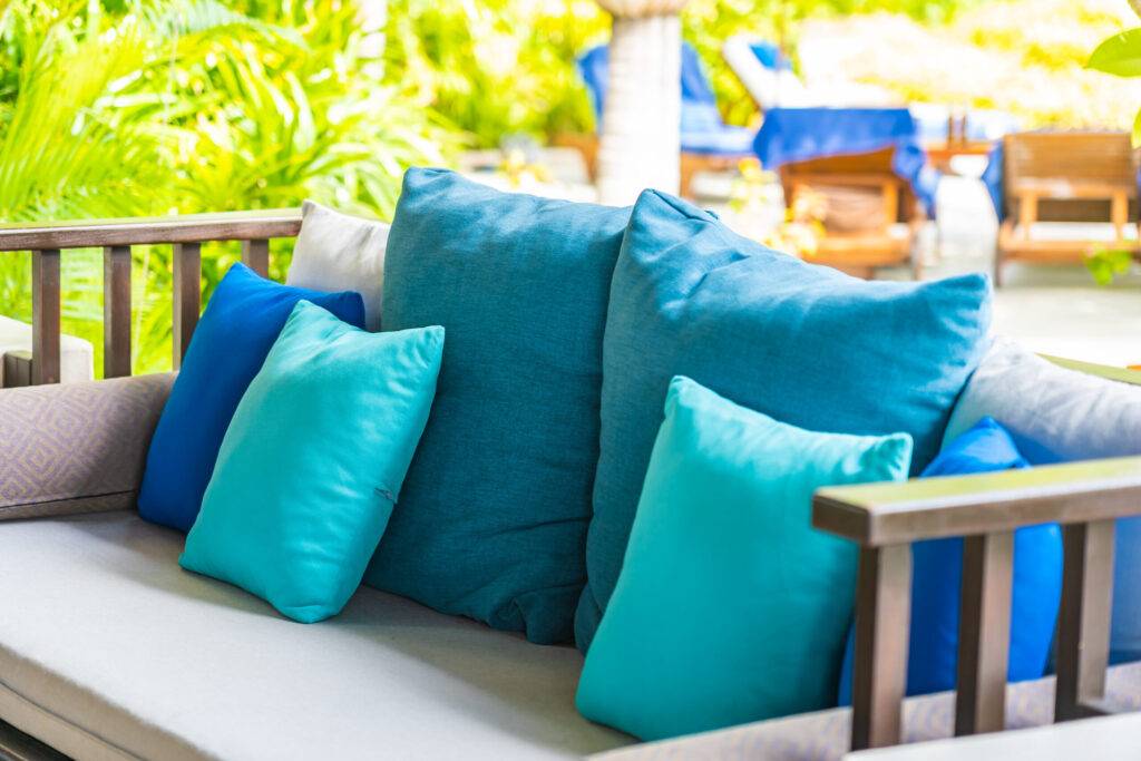 Comfortable pillow on sofa decoration outdoor patio Revitalize your outdoor space: How to dye patio cushion covers
