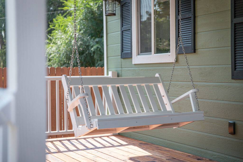 A bench swing at a home porch porch swing design