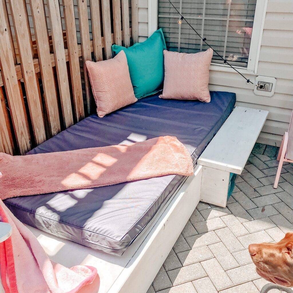 ciara an outdoor pallet bed styled with waterproof mattress and pillow covers