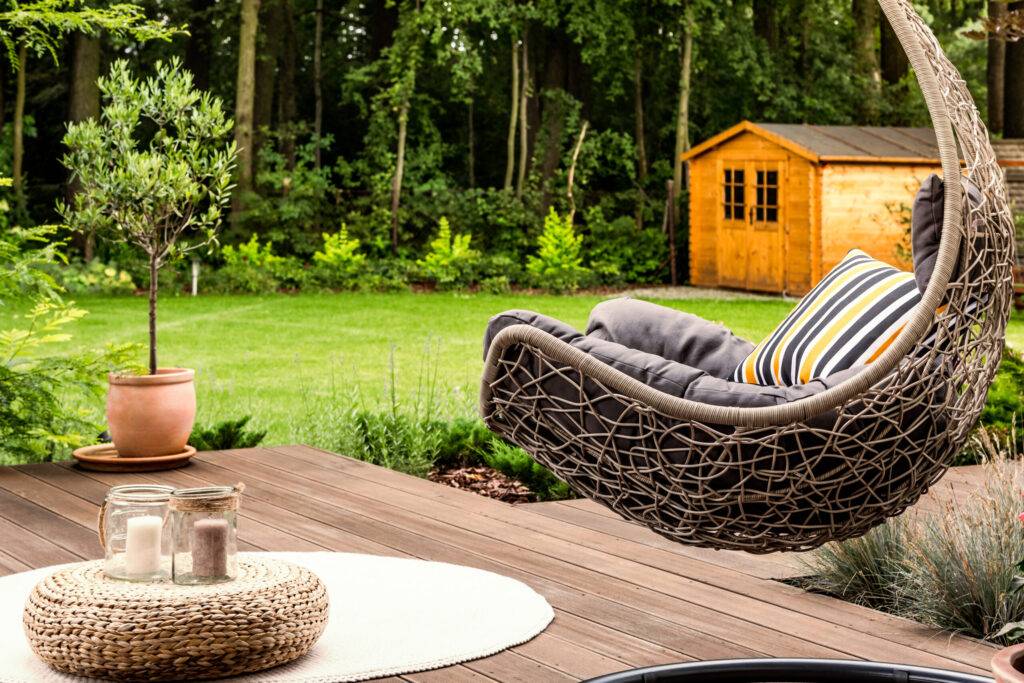 Hanging chair in the garden modern porch swing designs with pillows